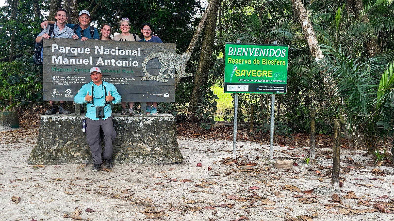 Wakoo Tours group at the Manuel Antonio National Park entrance sign