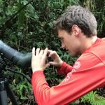 Guest holding a phone to a Swarovski spotting scope to photograph wildlife in the Manuel Antonio rainforest