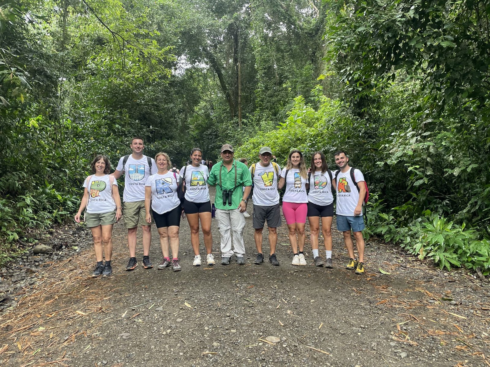 Small group of guests with their naturalist guide on a forest trail inside Manuel Antonio National Park